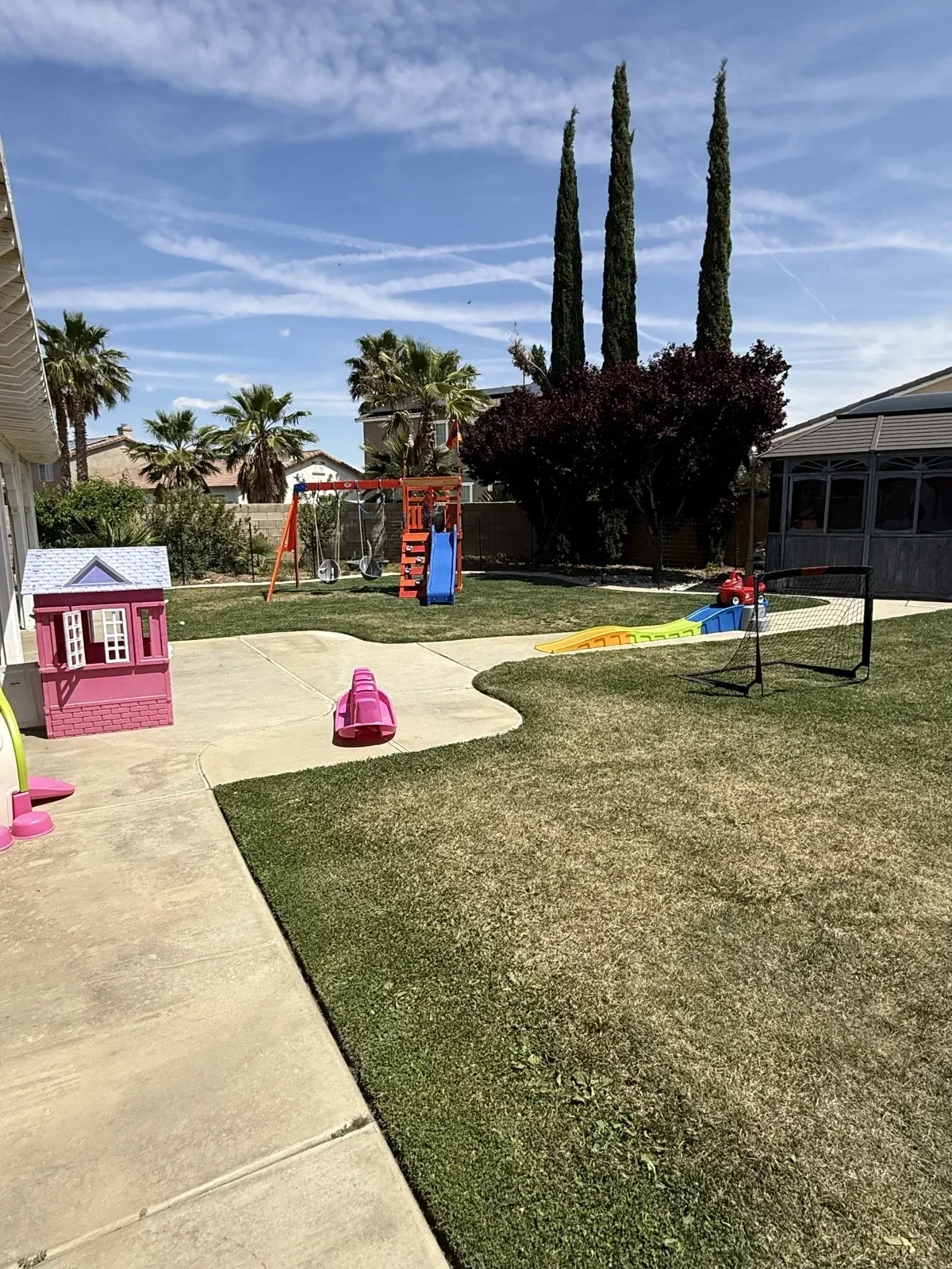 Backyard with Pink Playhouse and Soccer Goal at Fairy Tale Child Care Palmdale