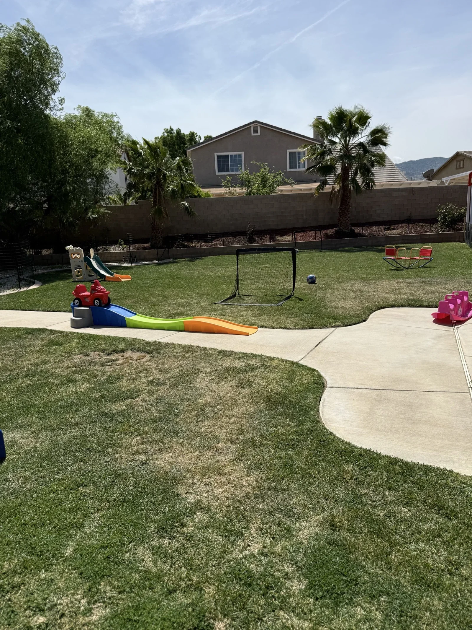 Backyard with Soccer Goal and Slide at Fairy Tale Child Care Palmdale