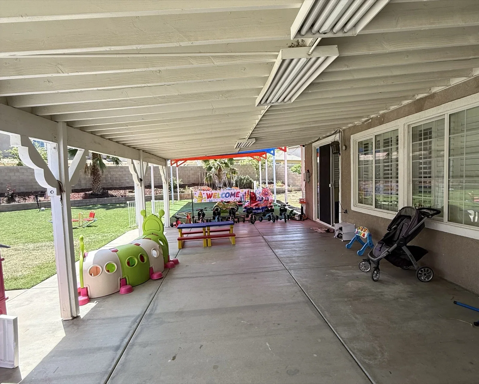 Covered Patio with Toys and Stroller at Fairy Tale Child Care Palmdale